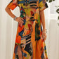 Vestido fluido em cores tropicais vibrantes