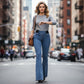 Calças de ganga femininas de cintura alta e corte largo em denim elástico